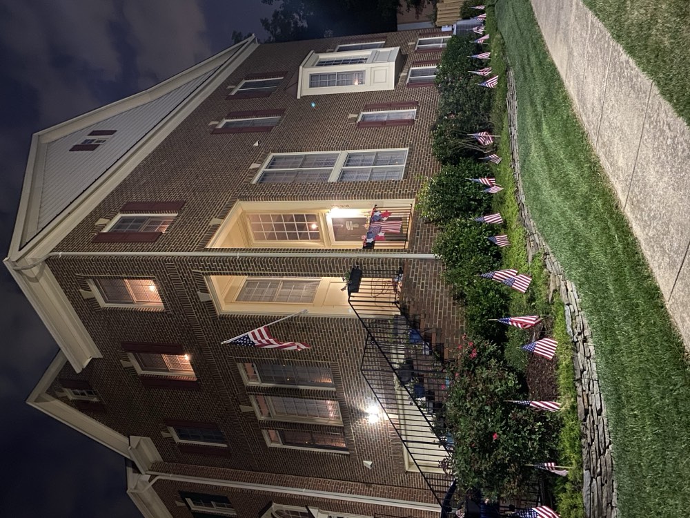 A home at the Ridges at Edsall decorated with flags at night
