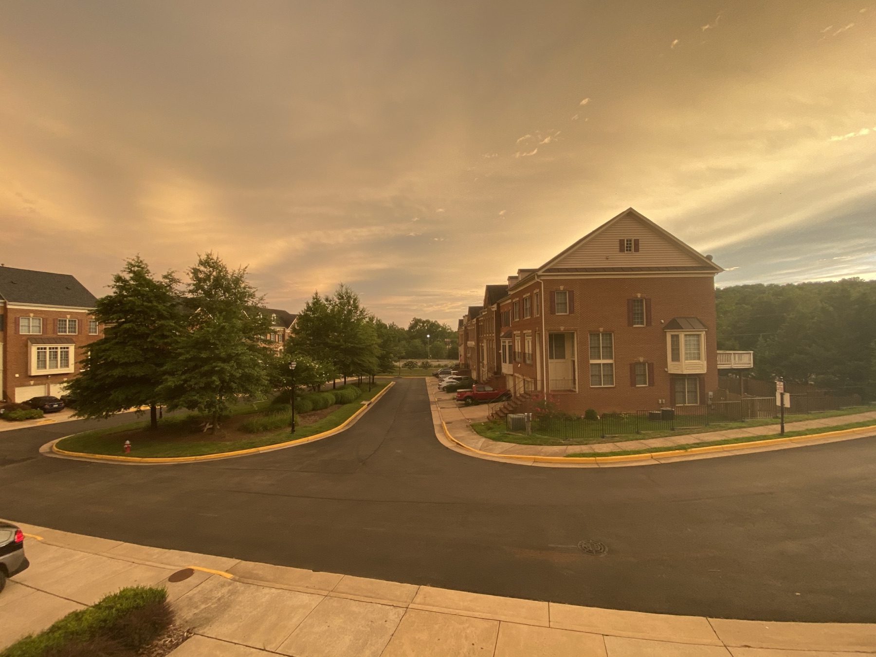 Street view of the Ridges at Edsall townhomes at sunset